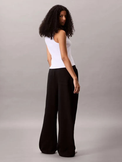 Pantaloni della tuta in spugna francese con monologo intessuto